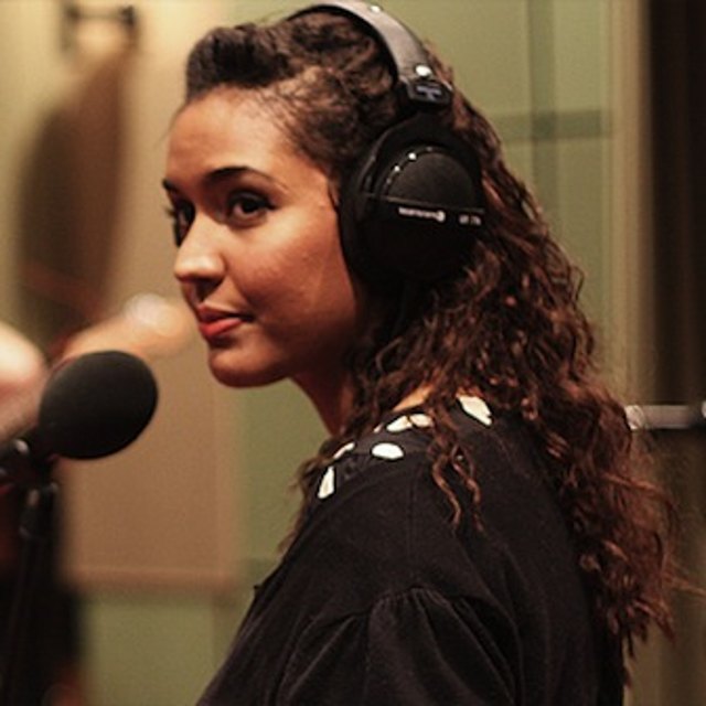 Portrait of LeaLea Jones in headphones at a studio microphone