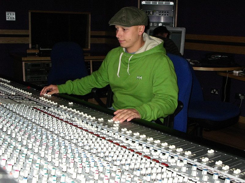 At the mixing desk in a recording studio
